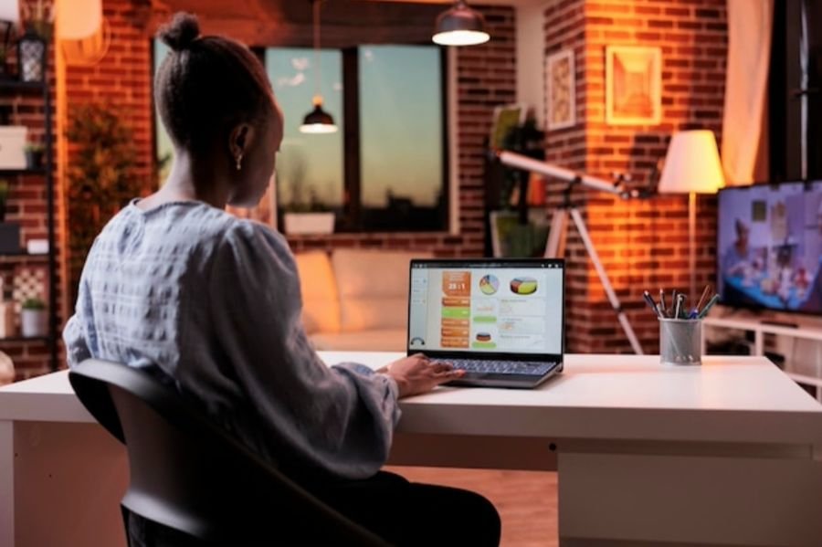 Planning a project at a laptop in a home office